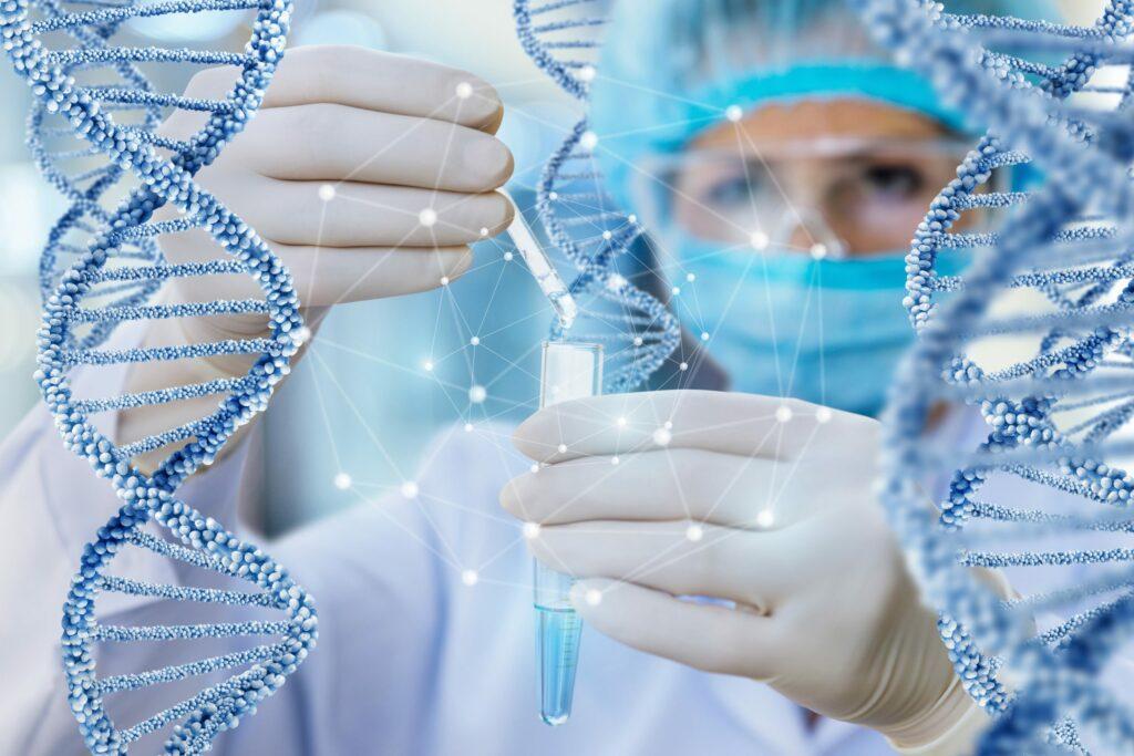 A gloved lab worker holding a pipette over a test tube, with DNA helix graphics